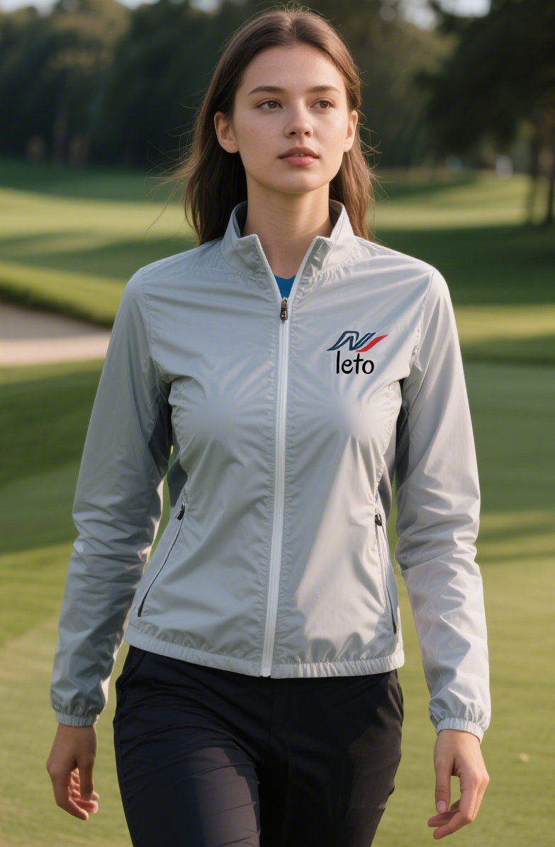 A country club staff member wearing a modern, insulated uniform with a tailored fit, standing confidently on a frosty golf course with snow-dusted trees in the background.